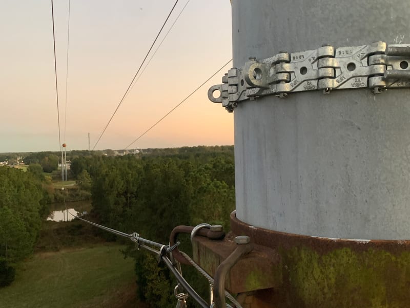 Aerial coax and fiber lashing on utility pole strand